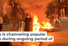 Iranians gather while blocking a street during a protest in Tehran on Jan. 9, 2026. MAHSA/Middle East Images/AFP via Getty Images